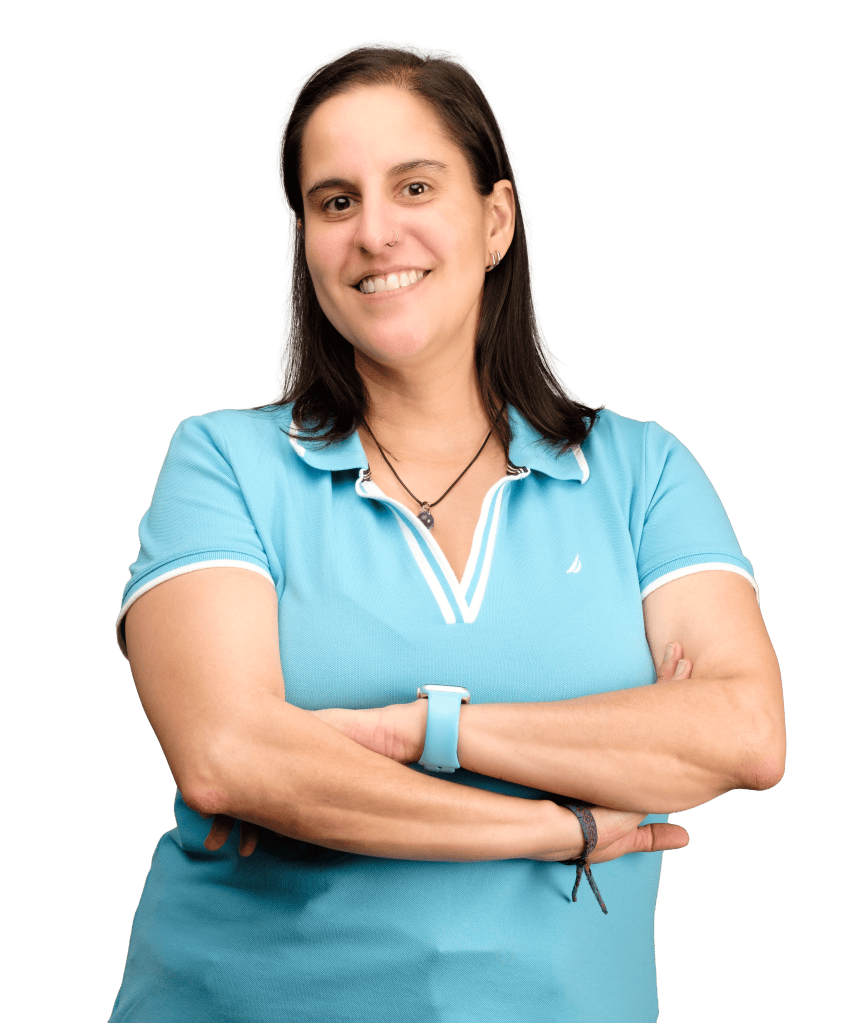 Dr. Candy Flores-Gracia smiling with her arms crossed.